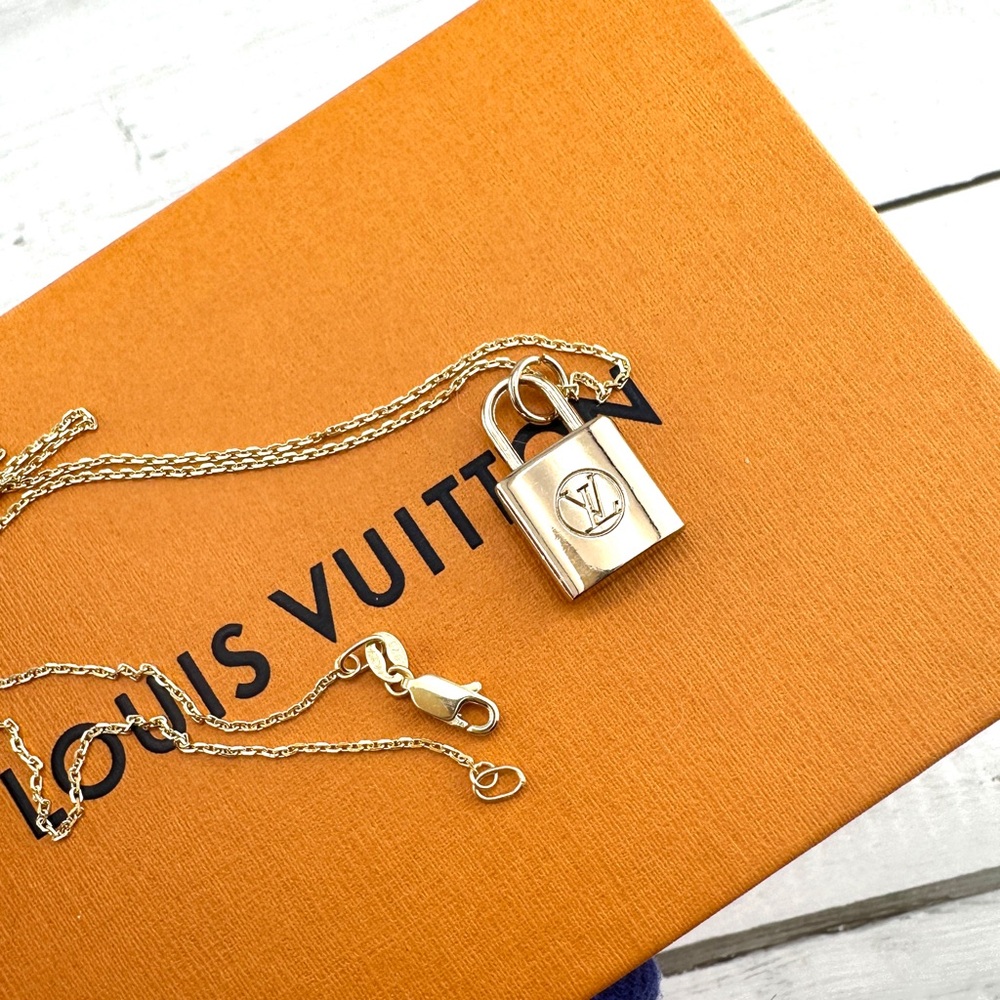 Gorgeous necklace repurposed with authentic Louis Vuitton Padlock bag charm.
